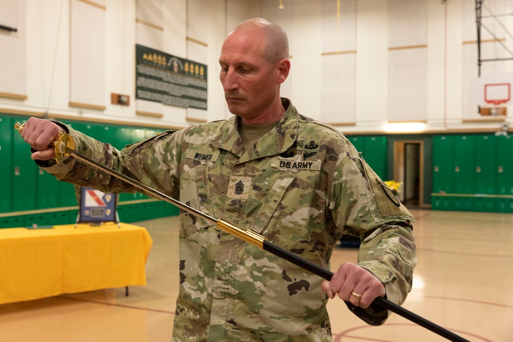 Command Sgt. Maj. Julie Small relinquishes responsibility of 297th Regional Support Group to Command Sgt. Maj. Ryan Weimer