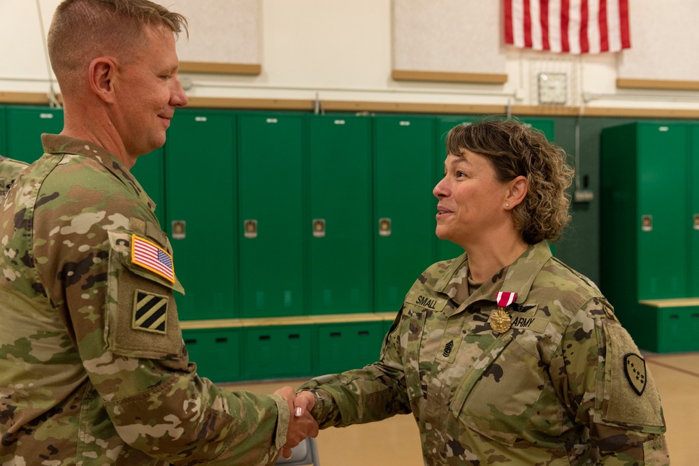 Command Sgt. Maj. Julie Small relinquishes responsibility of 297th Regional Support Group to Command Sgt. Maj. Ryan Weimer