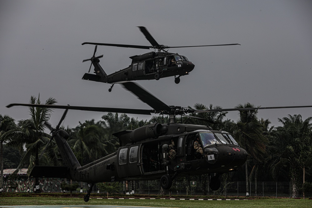 UH-60M Blackhawks landing for cold load training