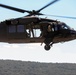 Scouts from the 1/110th Infantry Regiment rappel from a UH-60 Black Hawk during a live fire training exercise.