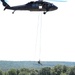 Scouts from the 1/110th Infantry Regiment rappel from a UH-60 Black Hawk during a live fire training exercise.