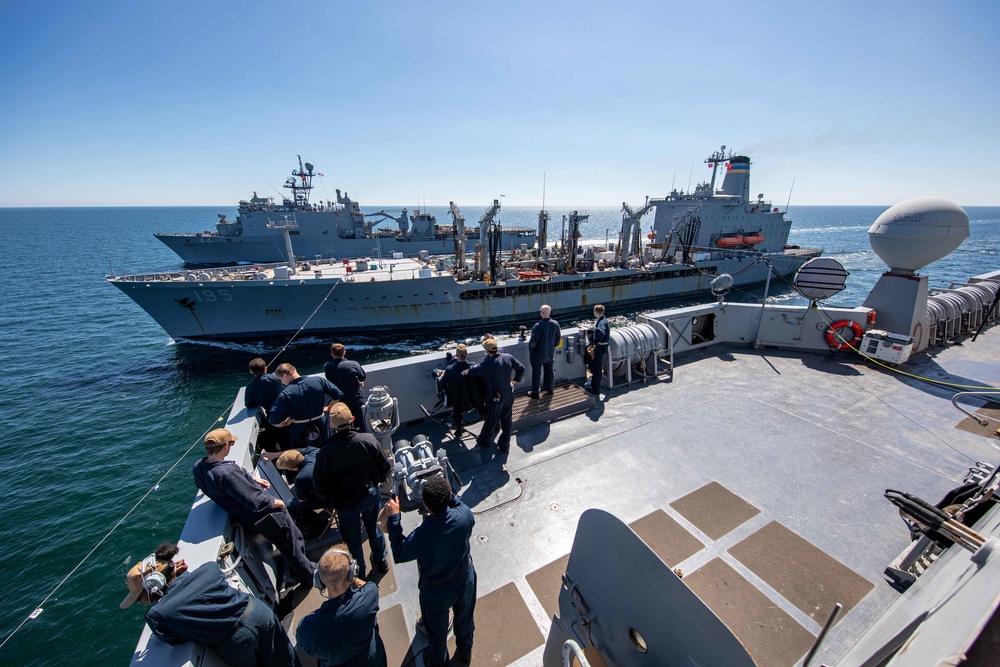 USS Arlington and USS Gunston Hall replenish simultaneously at sea