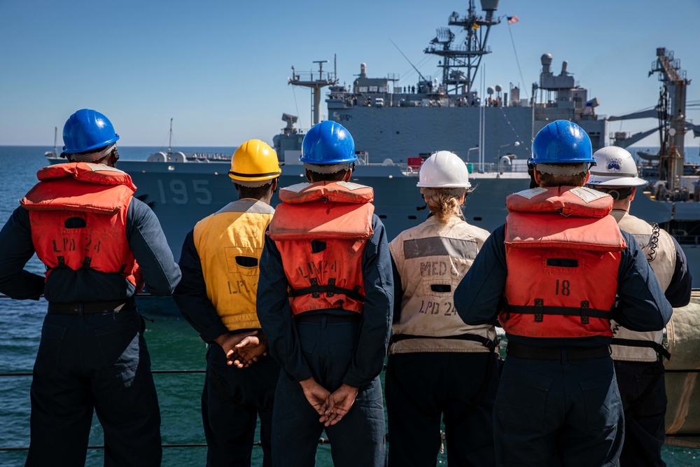 USS Arlington and USS Gunston Hall replenish simultaneously at sea