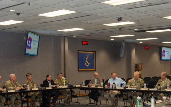 U.S. Army Lt. Gen. John Evans, U.S. Army North Commanding General, and his staff visit with U.S. Air Force Maj. Gen. David Gaedecke, Headquarters Sixteenth Air Force (Air Forces Cyber) Vice Commander, for a cyber-orientation briefing