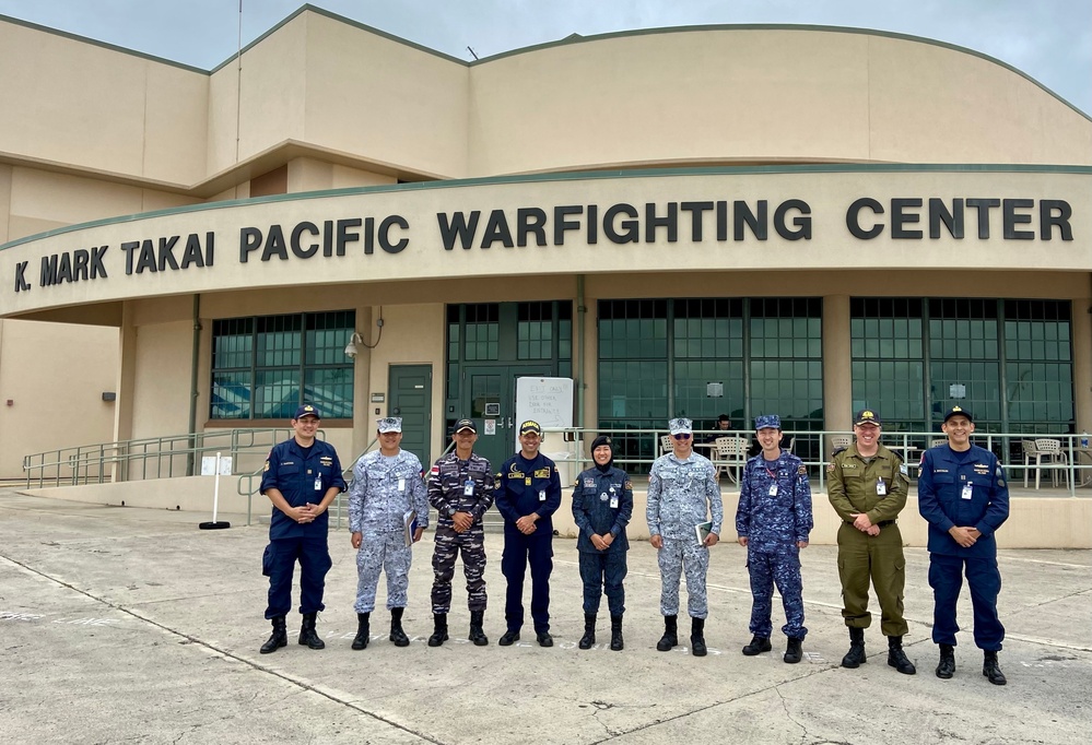 Partner Nations Pose Infront of Pacific Warfighting Center During RIMPAC 2022