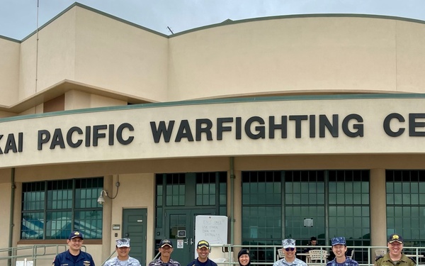 Partner Nations Pose Infront of Pacific Warfighting Center During RIMPAC 2022