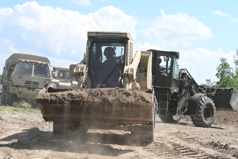 Army engineers building bridges, berms and trails during annual training at Fort Drum