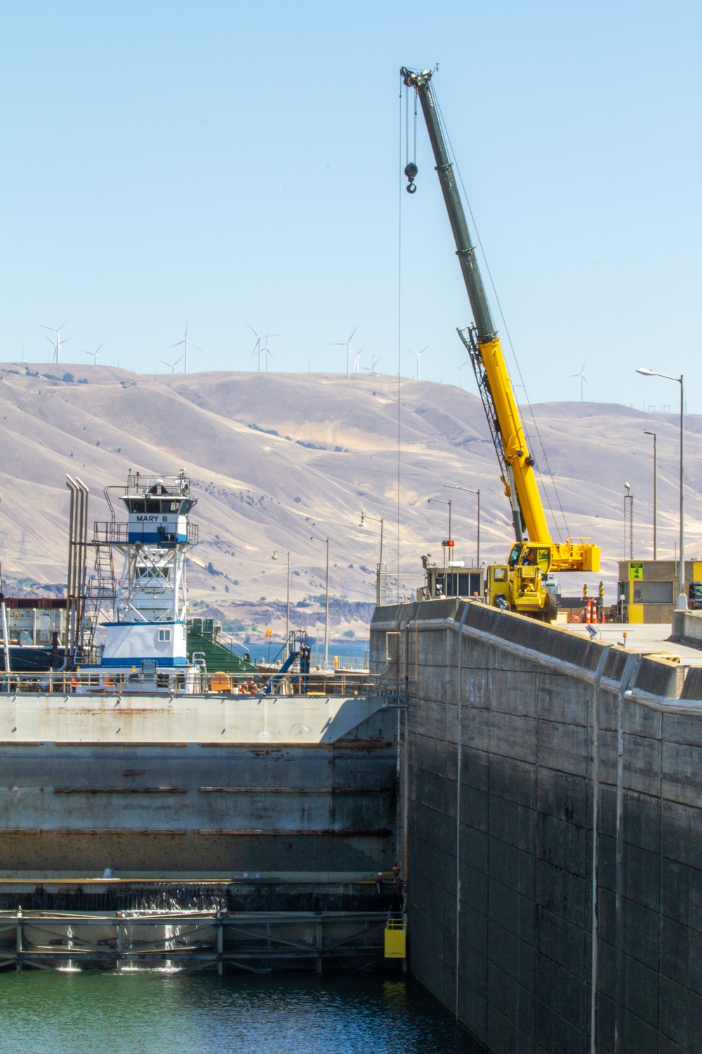 Crew work quickly to repair the upstream navigation lock gate at John Day Lock and Dam, with Portland District, U.S. Army Corps of Engineers, Aug 3.