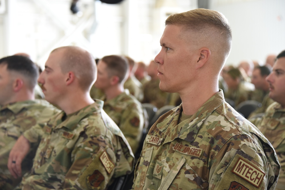 Airmen listen to their new commander