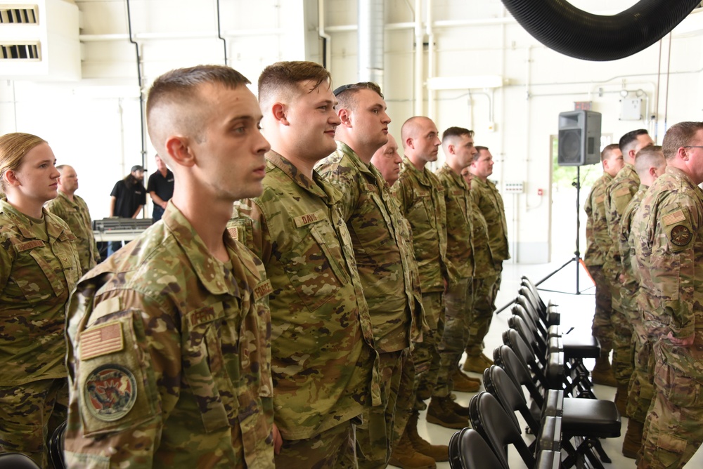 Airmen stand in formation for new commander