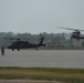 Public Affairs Airmen with Blackhawks
