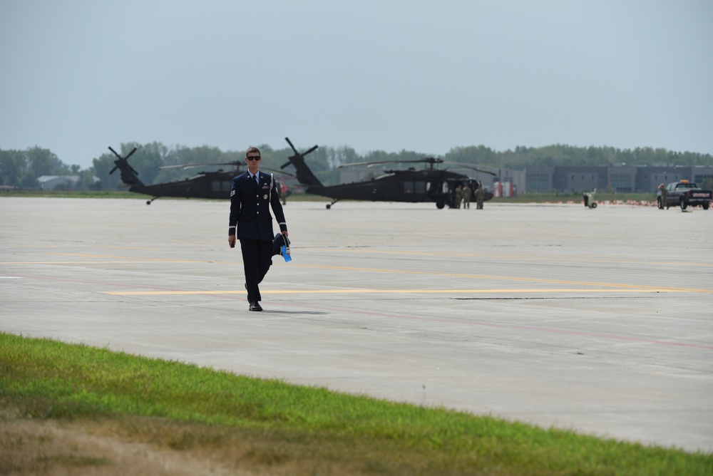 Base Honor Guard member walks on flight line