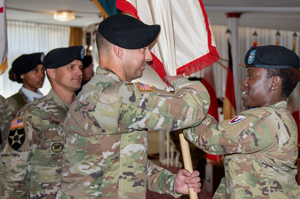 405th AFSB commander passes brigade colors to new command sergeant major