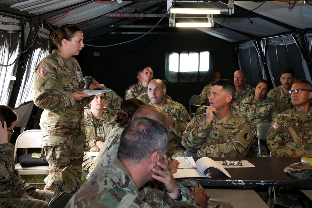 US Army Captain briefs Colonel on operations