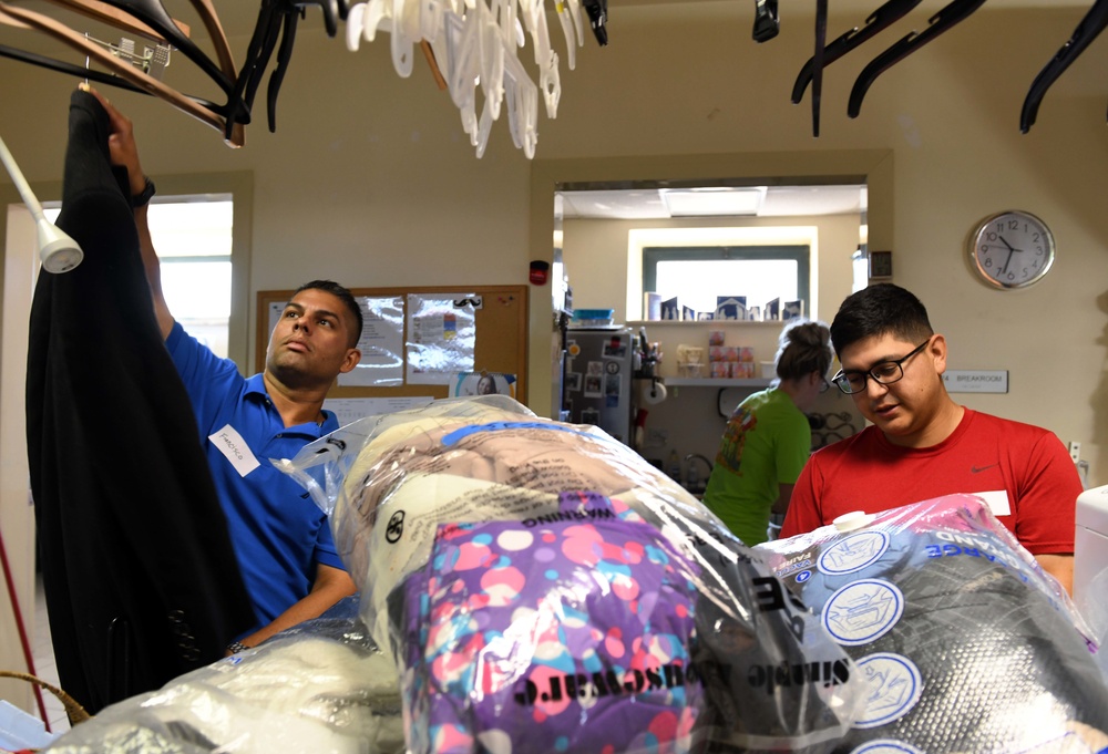 NSA Naples' Sailors Volunteer for NMCRS Thrift Shop Re-Opening