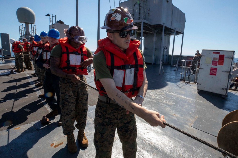 U.S. SAILORS PARTICIPATE IN A RENPLENISHMENT AT SEA