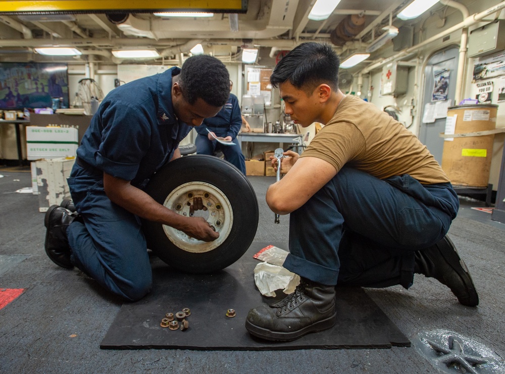 USS Ronald Reagan (CVN-76) AIMD Sailors assemble aircraft tires