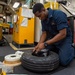 USS Ronald Reagan (CVN-76) AIMD Sailors assemble aircraft tires