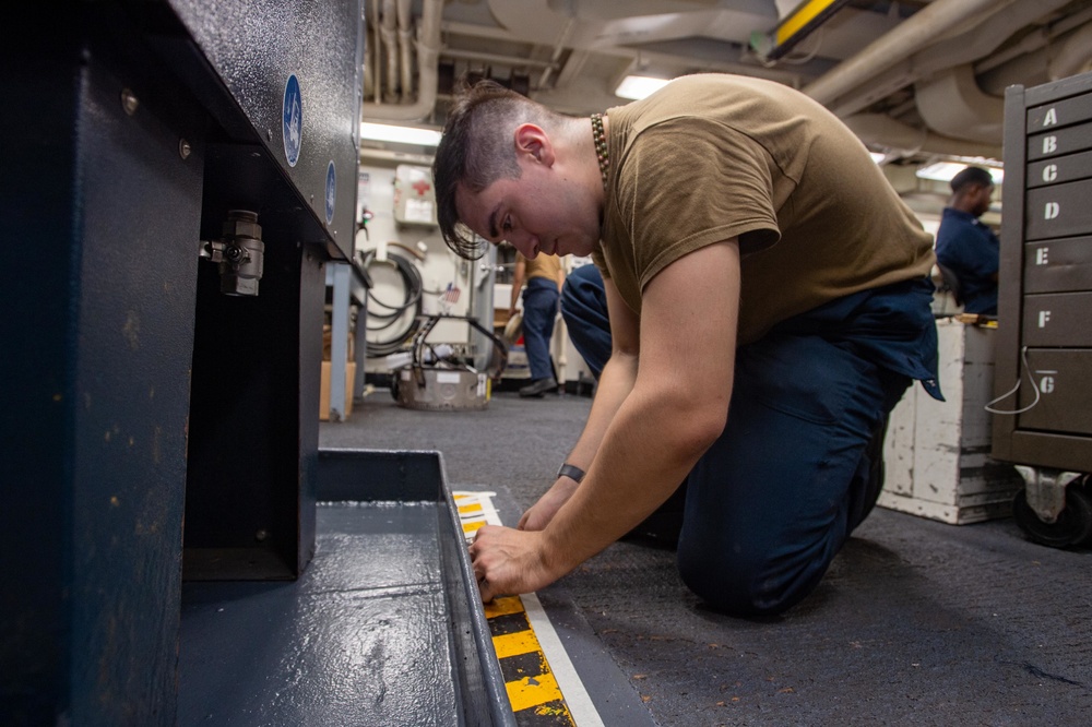 USS Ronald Reagan (CVN-76) AIMD Sailors assemble aircraft tires