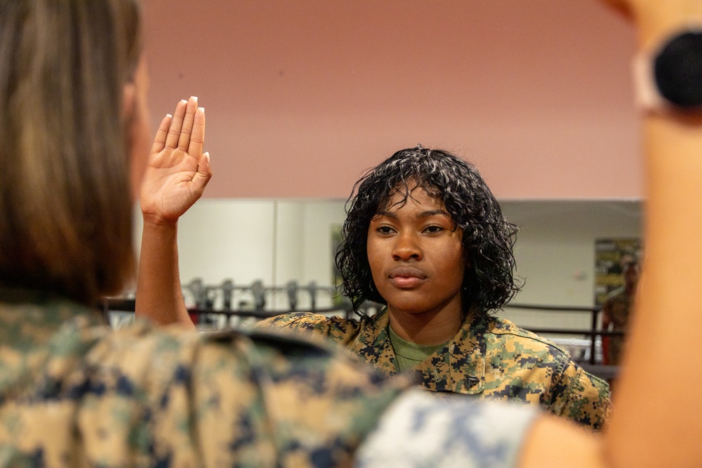 U.S. Marine reenlists as part of First Term Alignment Program