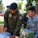 428th Fighter Squadron, RSAF members donate food to community