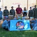 428th Fighter Squadron, RSAF members donate food to community