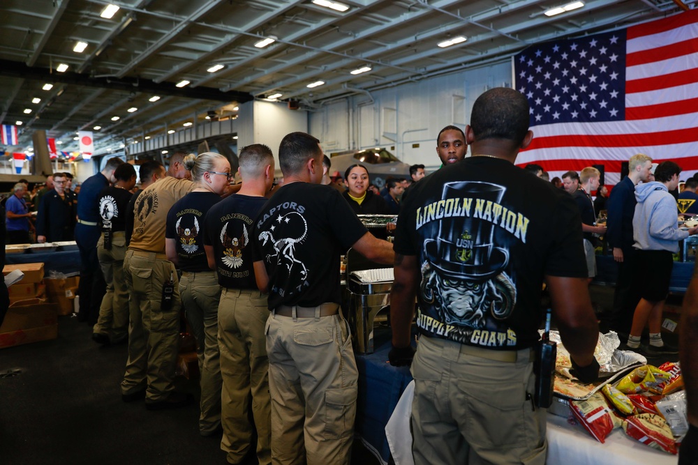 Abraham Lincoln embarked guests, Sailors, Marines participate in steel cave picnic