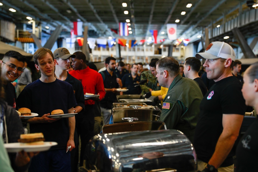 Abraham Lincoln embarked guests, Sailors, Marines participate in steel cave picnic