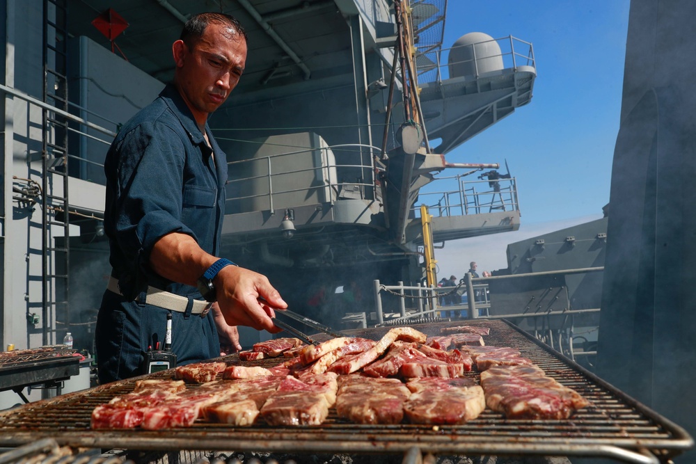 Abraham Lincoln embarked guests, Sailors, Marines participate in steel cave picnic