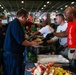 Abraham Lincoln embarked guests, Sailors, Marines participate in steel cave picnic