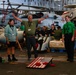 Abraham Lincoln embarked guests, Sailors, Marines participate in steel cave picnic