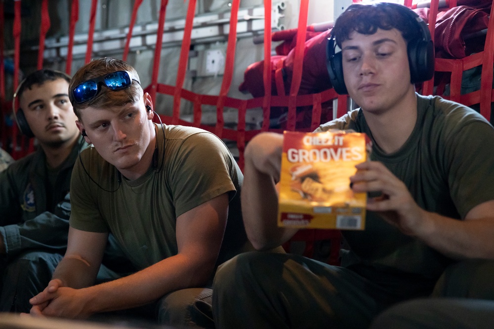 Marines pass the time on a KC-130J Hercules