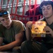 Marines pass the time on a KC-130J Hercules