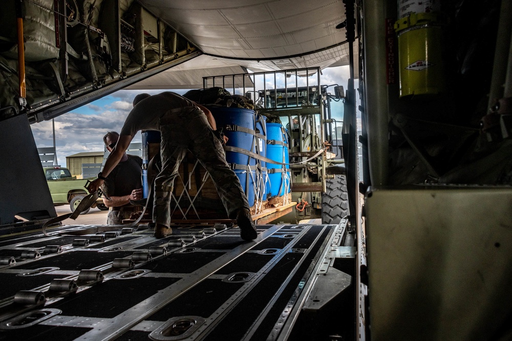 MC-130J Commando IIs conduct nighttime three-ship formation operations