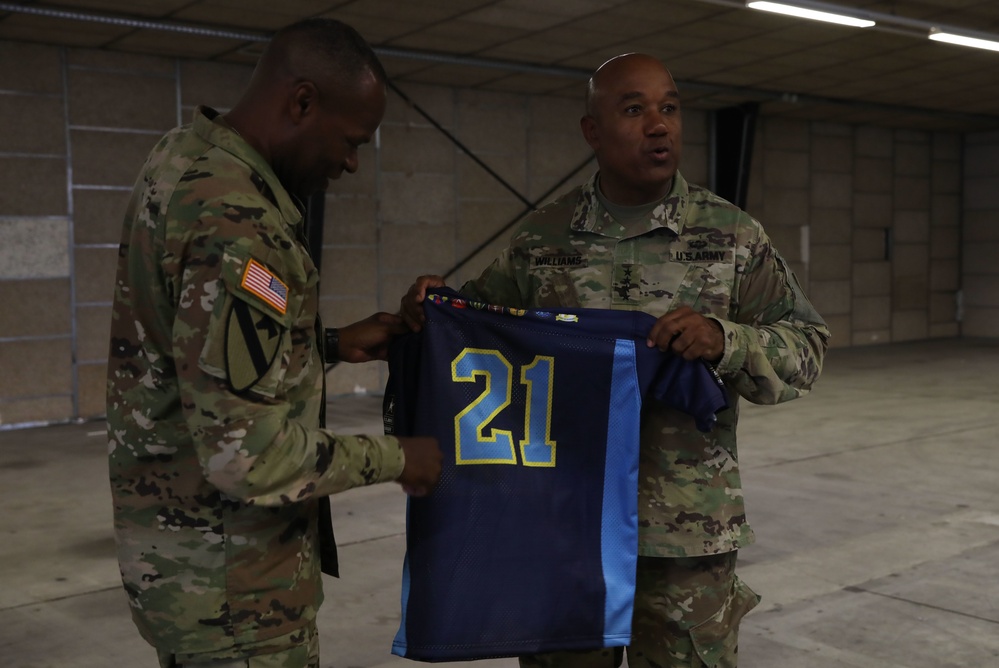 U.S. Army Gen. Darryl A. Williams is given a gift from Maj. Gen. James M. Smith