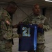 U.S. Army Gen. Darryl A. Williams is given a gift from Maj. Gen. James M. Smith