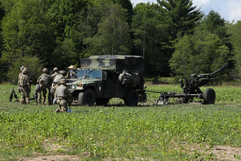 U.S. Army Soldiers, 1-134th Field Artillery Regiment, await confirmation to fire at Northern Strike 22-2