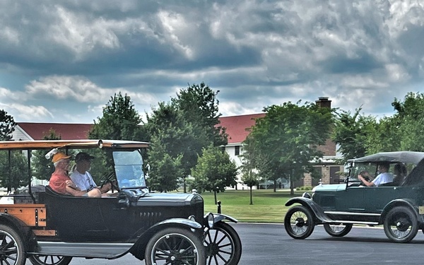 Model T Fords cruise through Fort McCoy's historic Commemorative Area