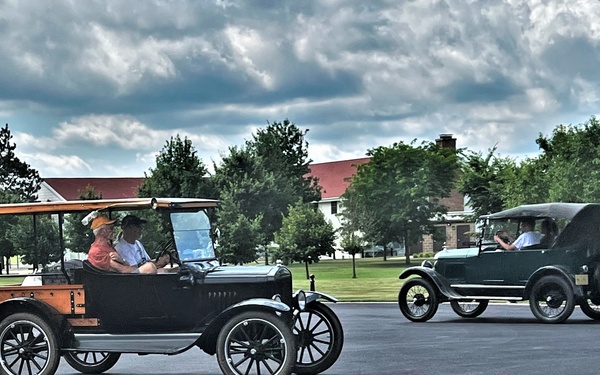 Model T Fords cruise through Fort McCoy's historic Commemorative Area