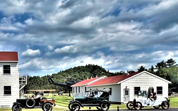 Model T Fords cruise through Fort McCoy's historic Commemorative Area
