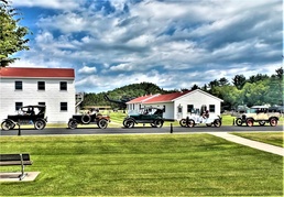 Model T Fords cruise through Fort McCoy's historic Commemorative Area