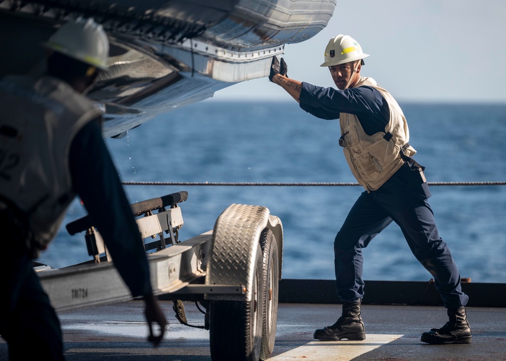 Sailors deploy small boats