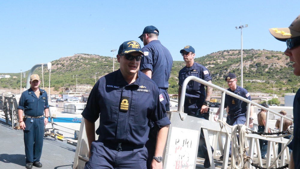 Triad from the Royal Navy submarine Audacious visits USS Forrest Sherman