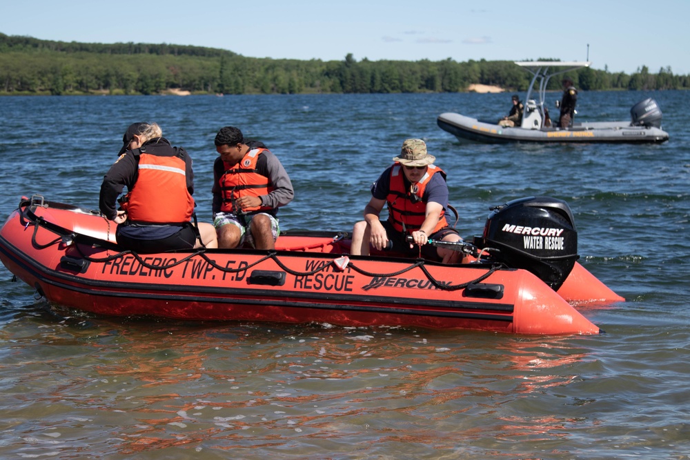 Frederic Firefighters provide EMT rescue swimmer to Northern Strike helocast operations