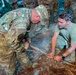 Airmen learn to start a fire with rudimentary tools