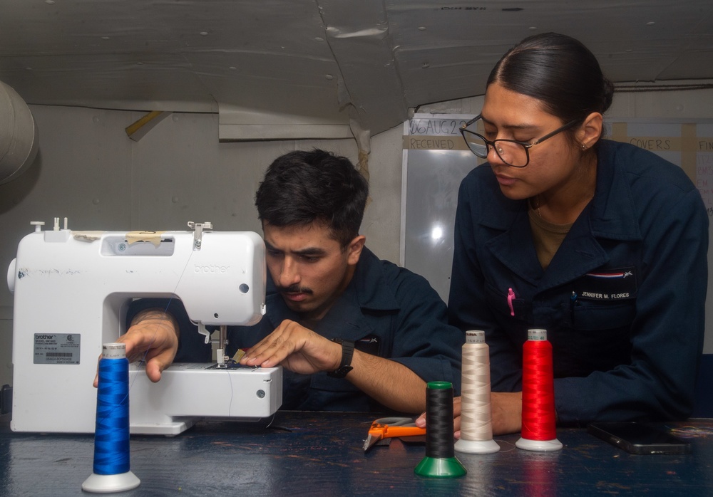 USS Ronald Reagan (CVN 76) Sailors work in the canvas shop