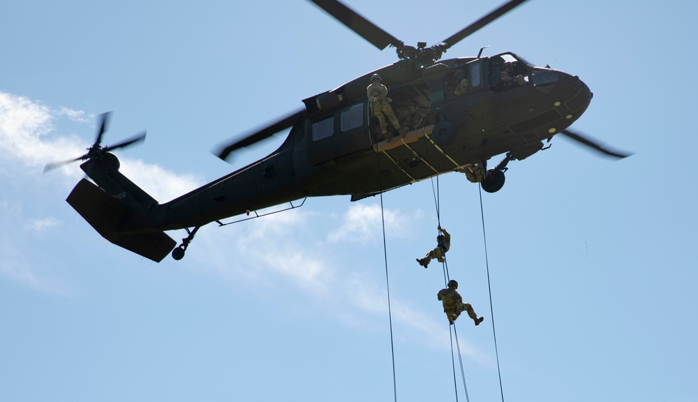 Soldiers rappel from UH-60 Black Hawk During Air Assault