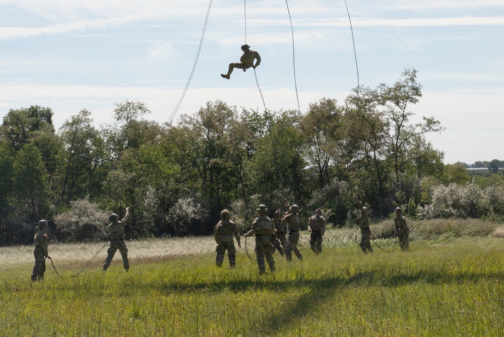 Soldiers rappel from UH-60 Black Hawk During Air Assault