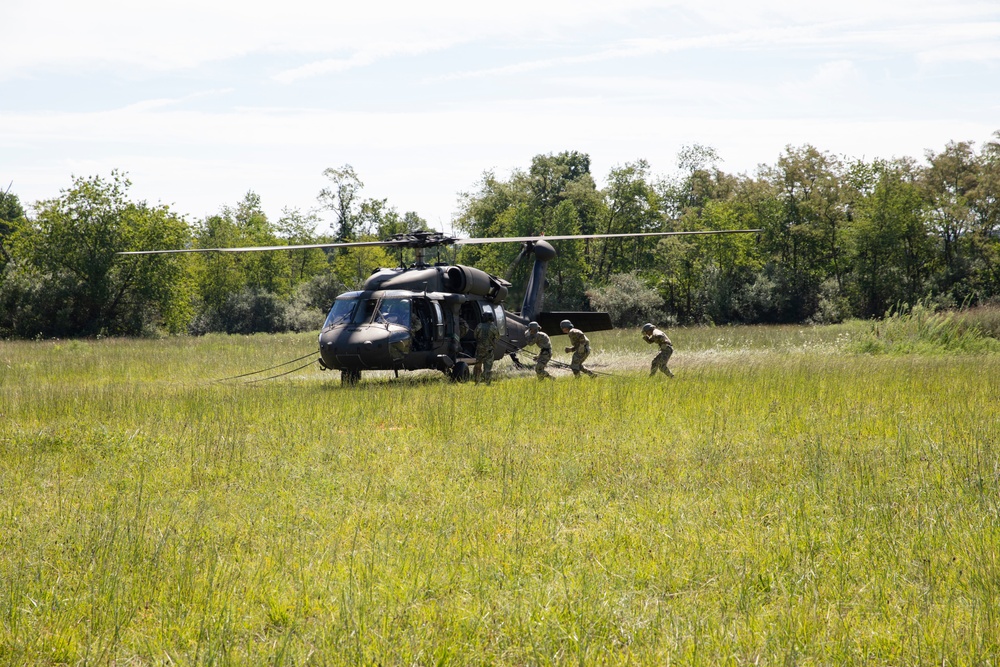 Soldiers rappel from UH-60 Black Hawk During Air Assault