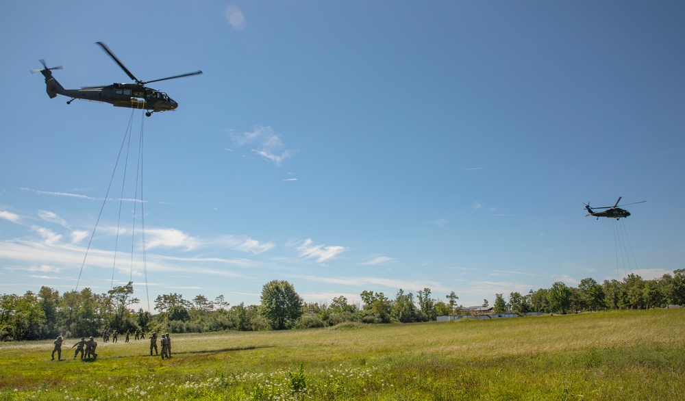 Soldiers rappel from UH-60 Black Hawk During Air Assault